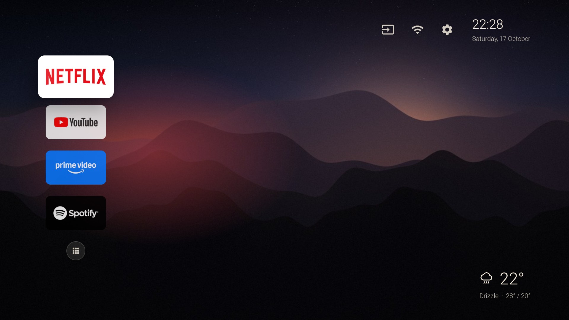 After: a dark dusk-mountain wallpaper with Netflix, YouTube, Prime Video and Spotify in a rail on the left, the time at the top right and the weather at the bottom right.
